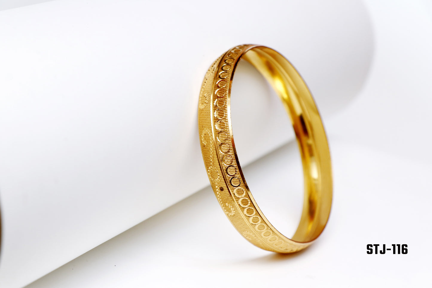 Gold Bangle with Circular and Textured Engravings