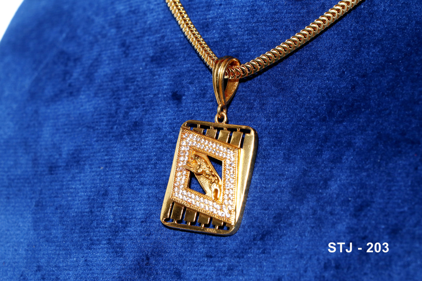 Men's locket from Standtouch featuring a gold pendant with geometric design and a panther motif.