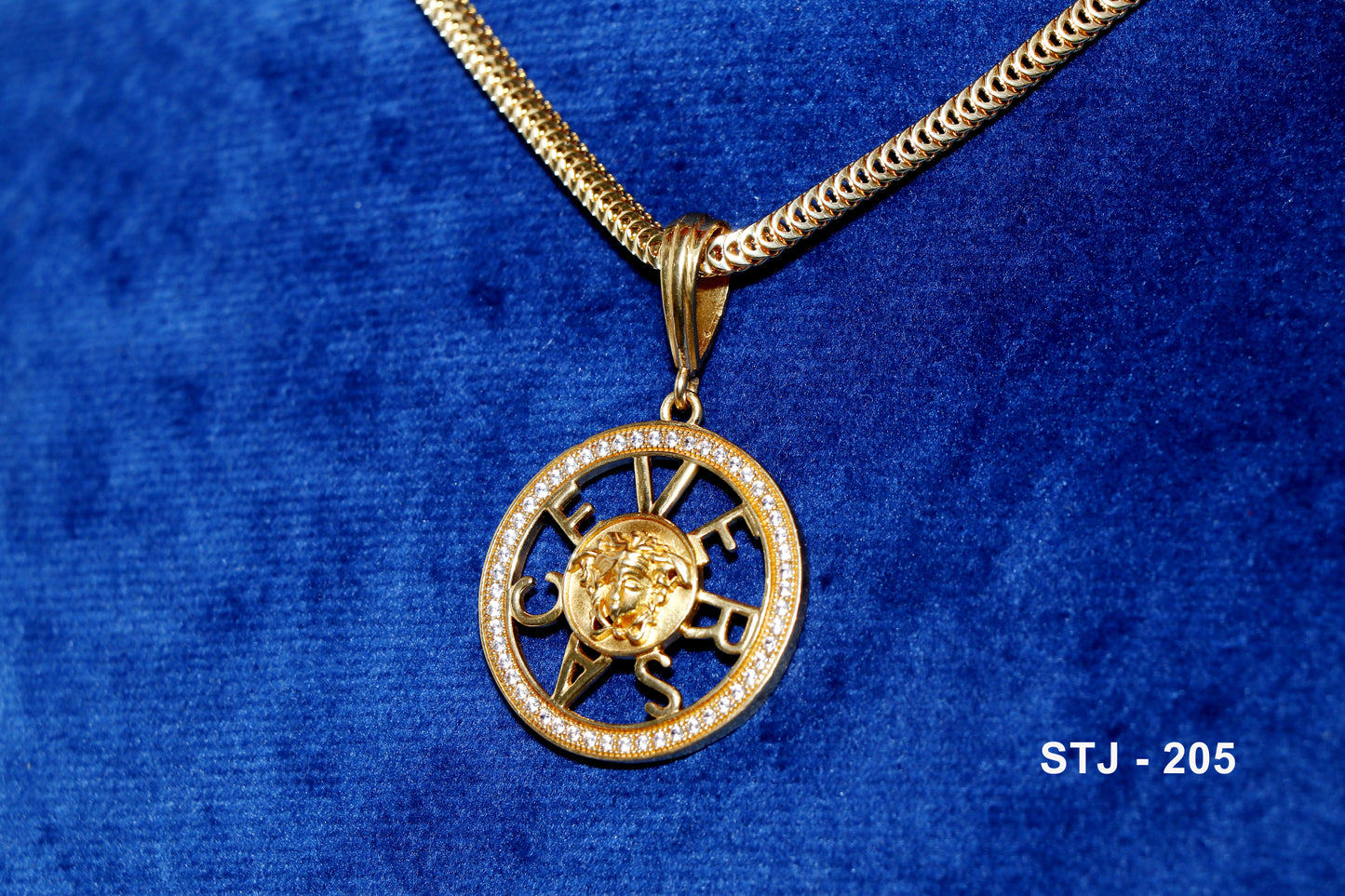 Gold Plated circular men's locket with motif and studded detailing.