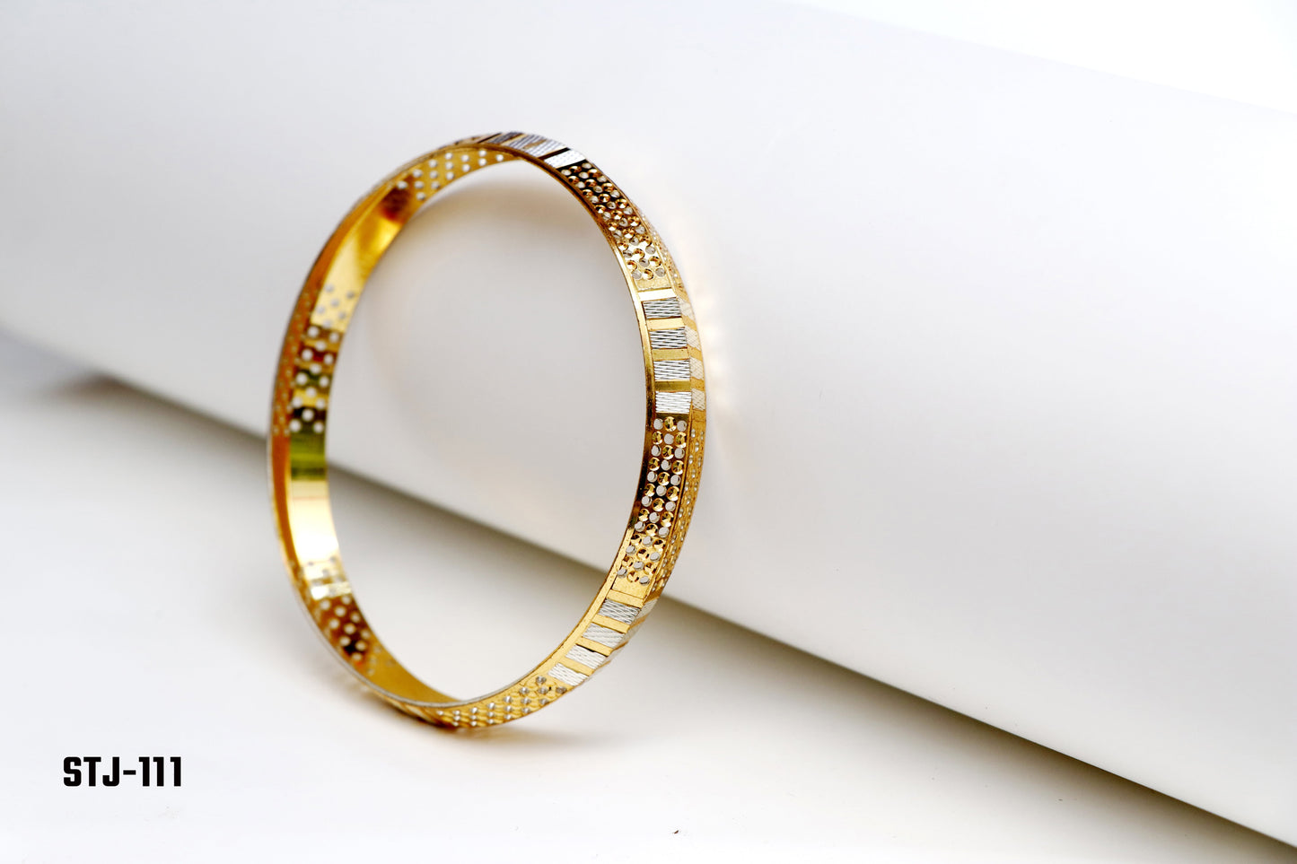 Gold Bangle with Textured and Cutout Patterns