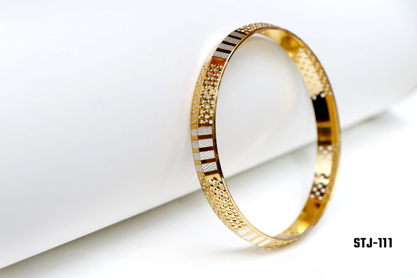 Gold Bangle with Textured and Cutout Patterns